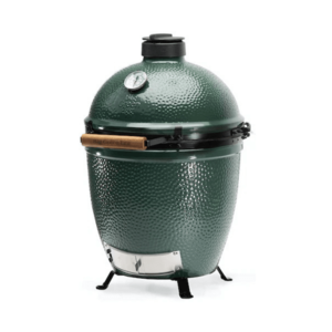 Prominent Big Green Egg grill, featuring a distinctive green color and ceramic design for versatile outdoor cooking.